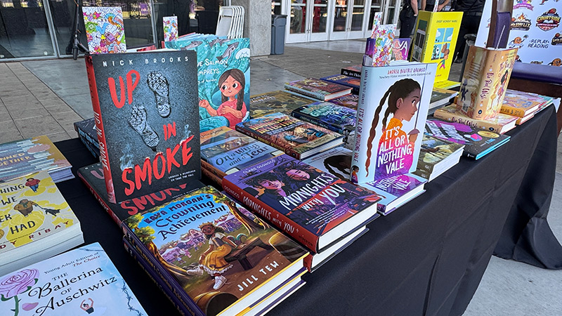 books laid out across a table
