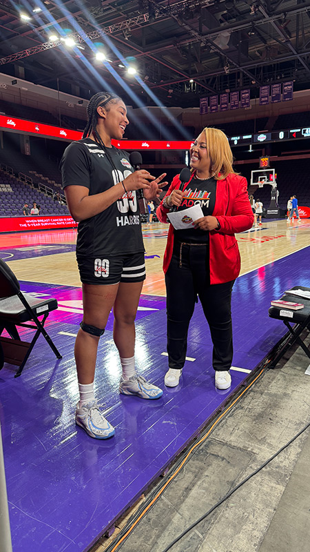 Helen Darling interviewing an athlete